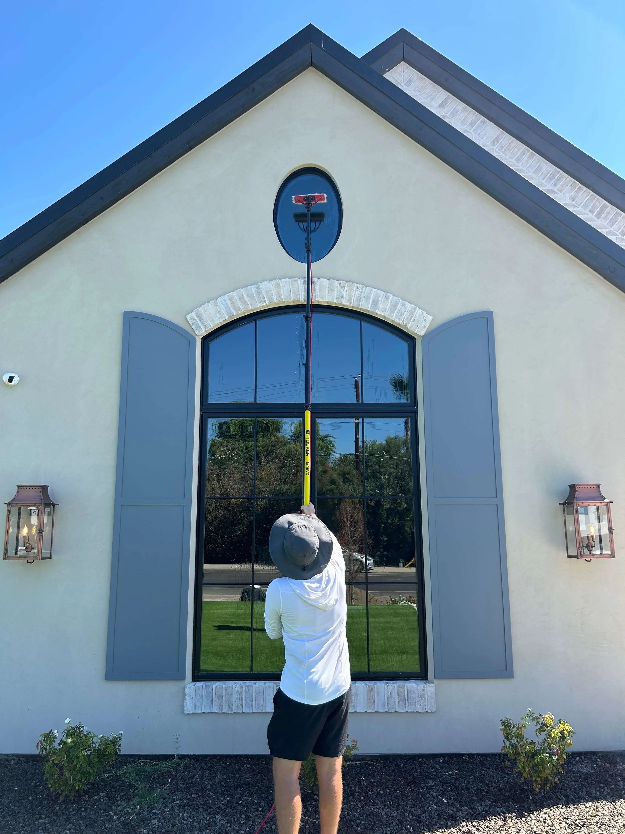 Residential window cleaning with a water-fed pole at an Arizona home